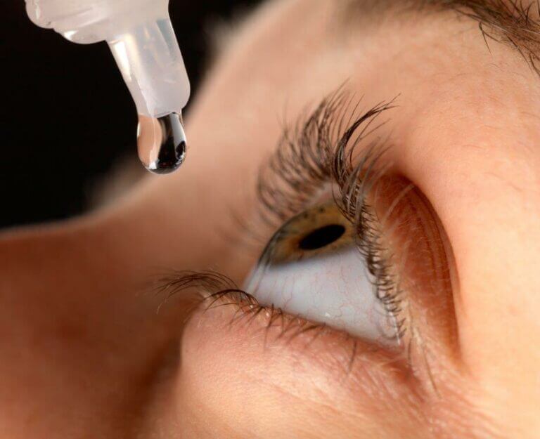 Person using eye drops