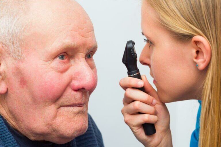 Older man having his eyes examined