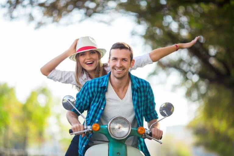 Happy couple on a scooter